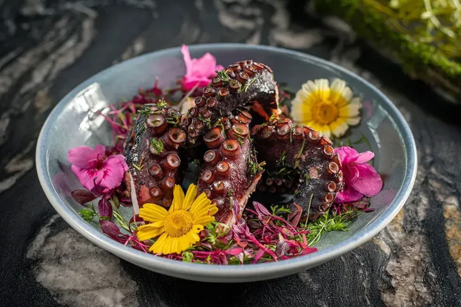 Grilled octopus with aromatic fresh herbs oil